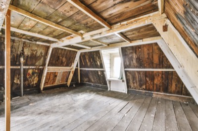 Photo of an empty loft room with a window